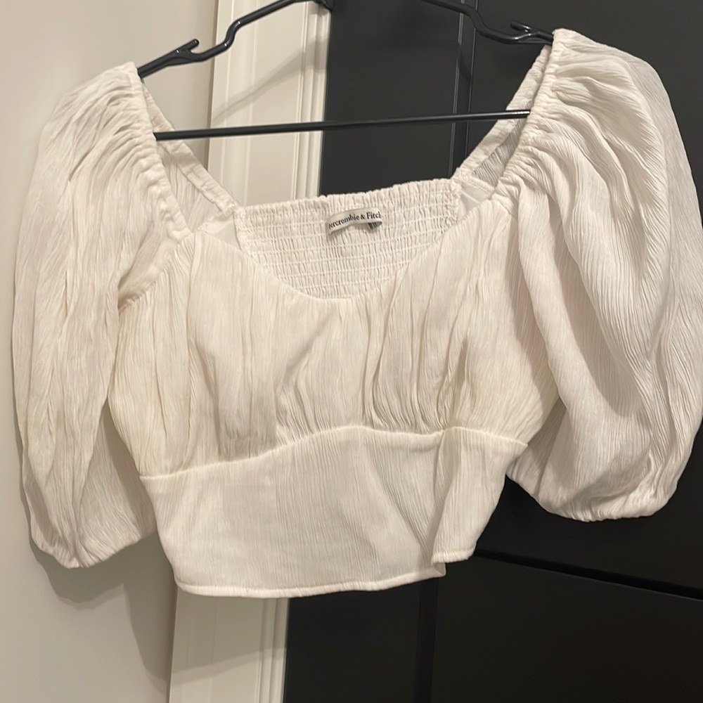 White crop top with puffy sleeves.  Barely worn